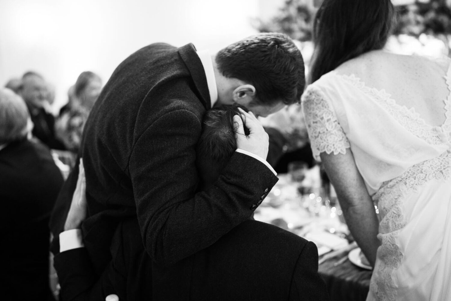 brother with hand on his brothers hand after emotional speech