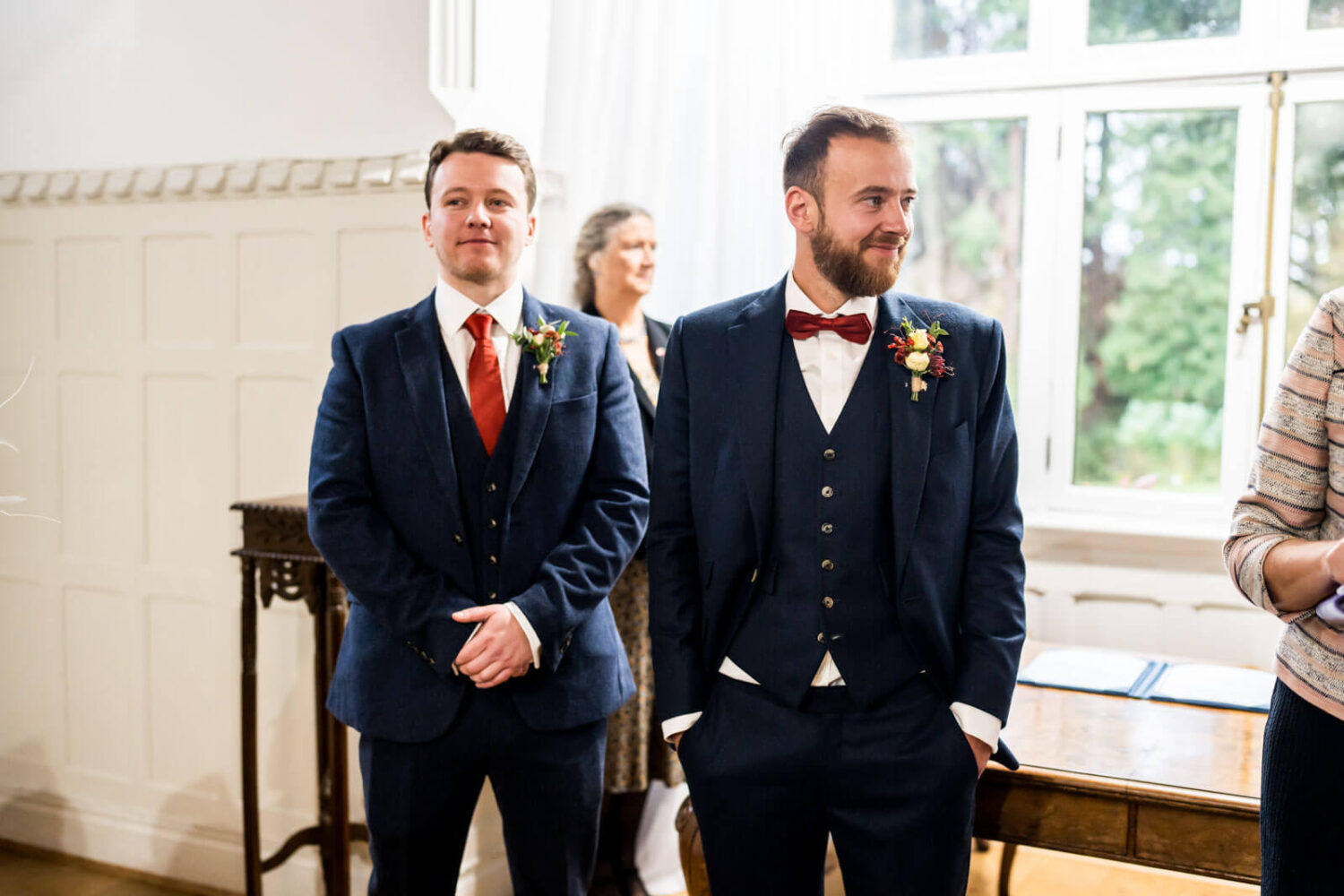 waiting groom smiles for bride at highley manor