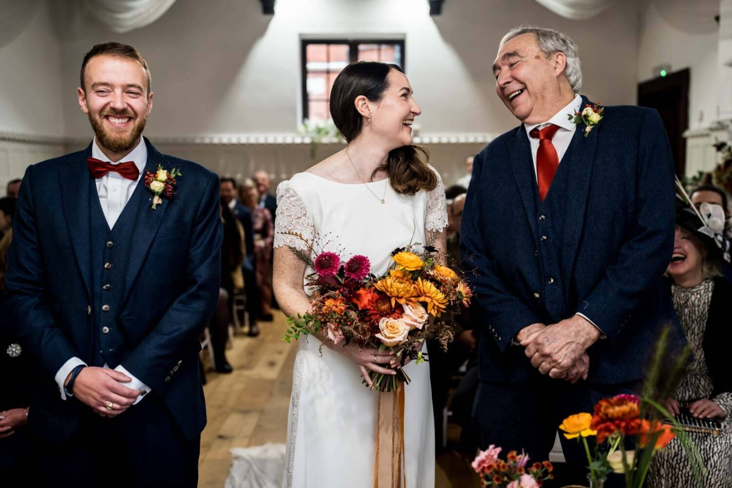 father and daughter laughing side by side at highley manor