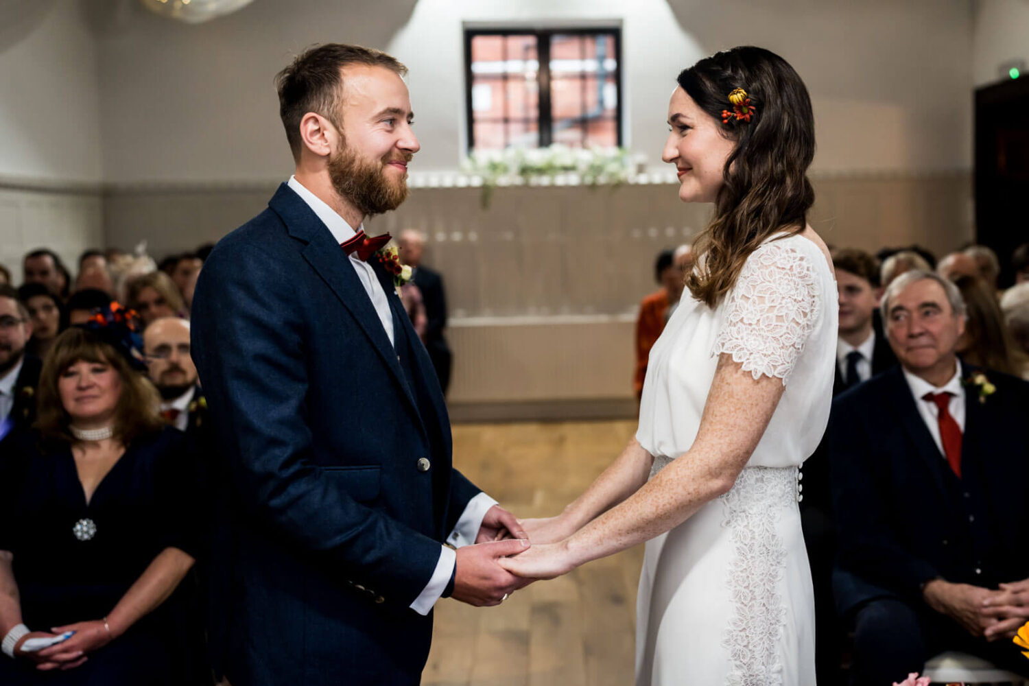 groom and bride holding hands at highley manor