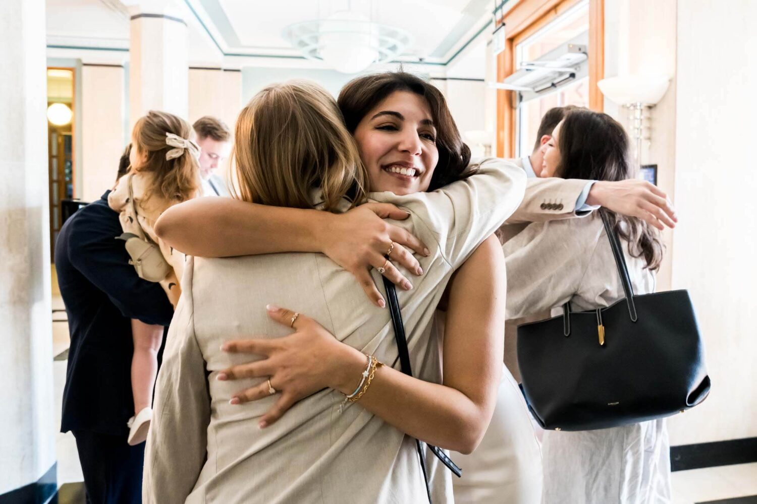 bride hugging friend london wedding