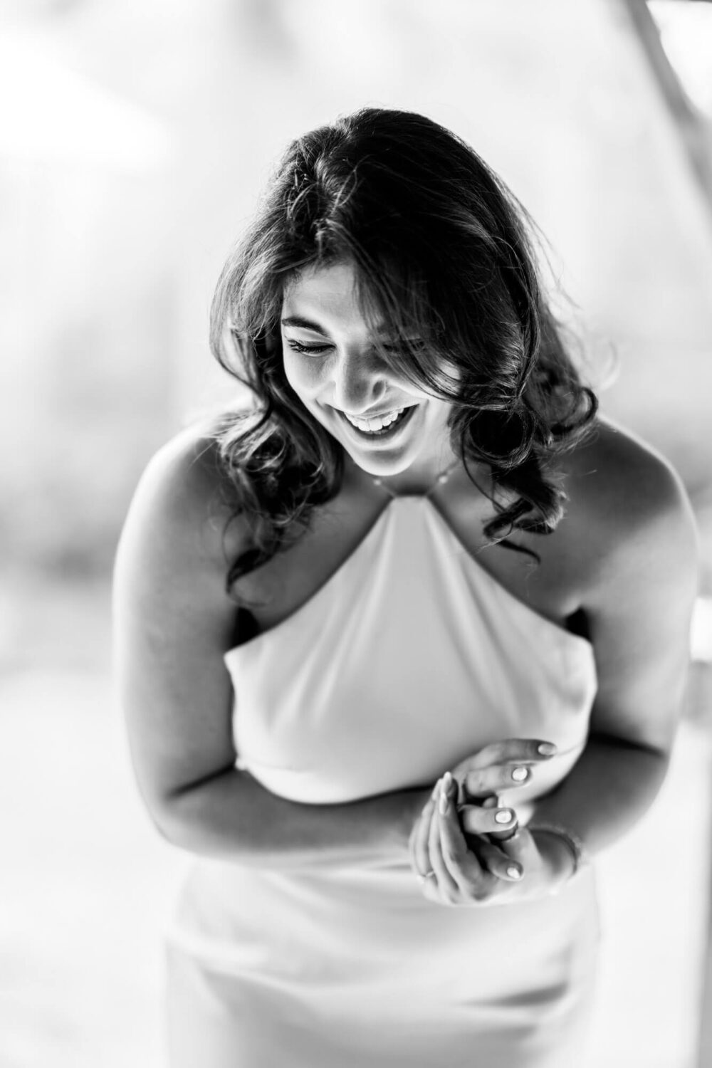 portrait of bride laughing holding her hands london wedding