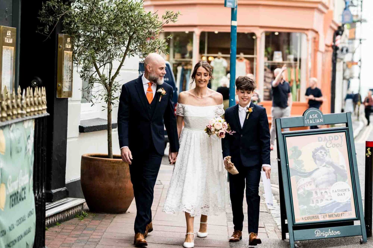 bride-groom-and-son-walking-the-streets-brighton-town-hall-wedding