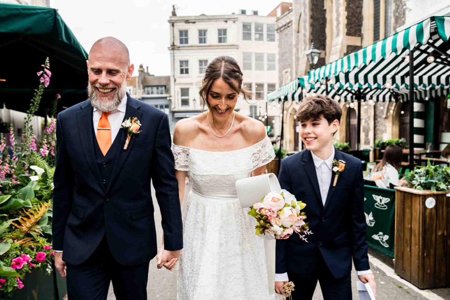 bride-groom-and-son-walking-the-streets-brighton-town-hall-wedding