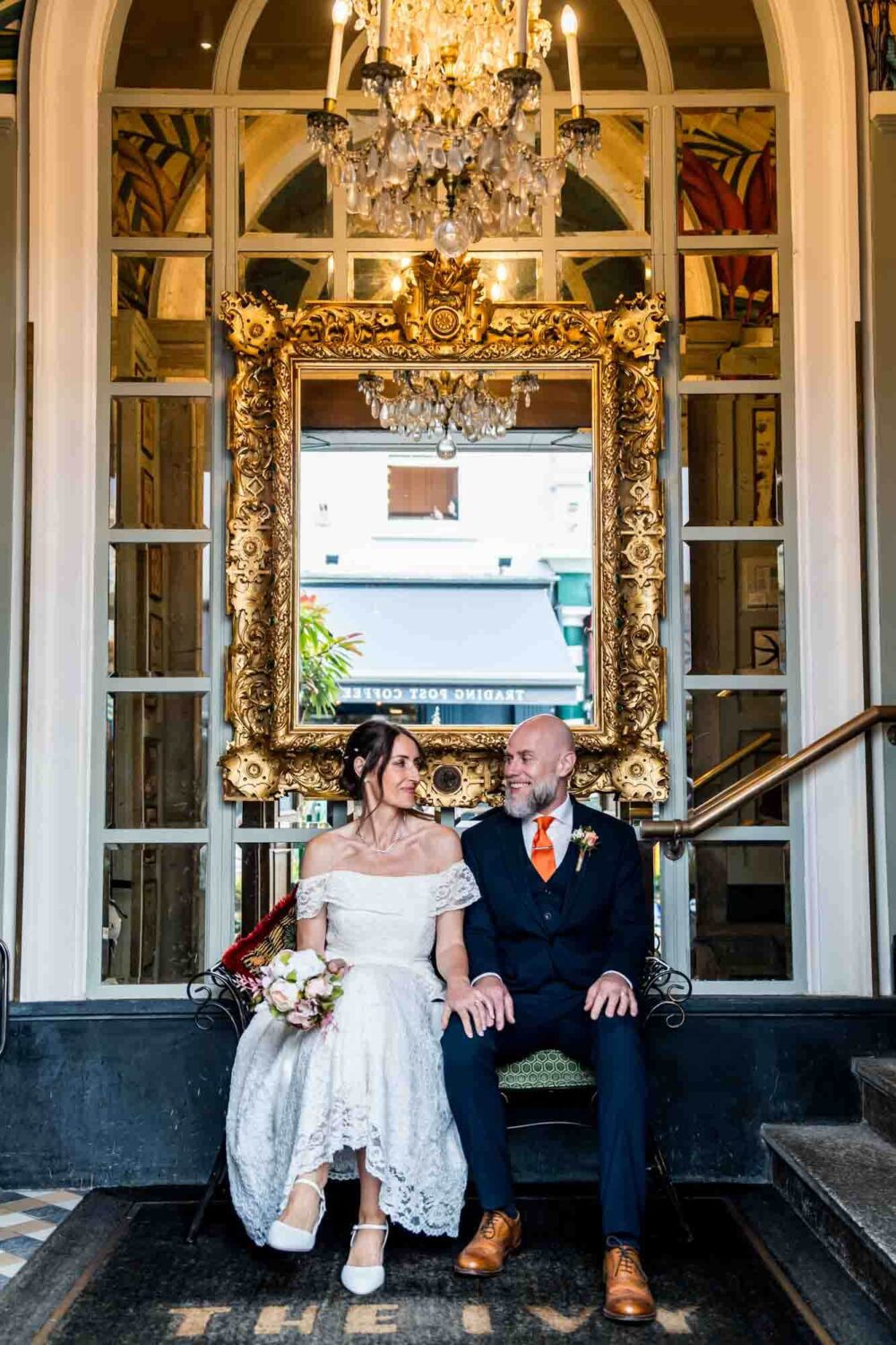 bride-and-groom-sitting in-ivy-brighton-town-hall-wedding
