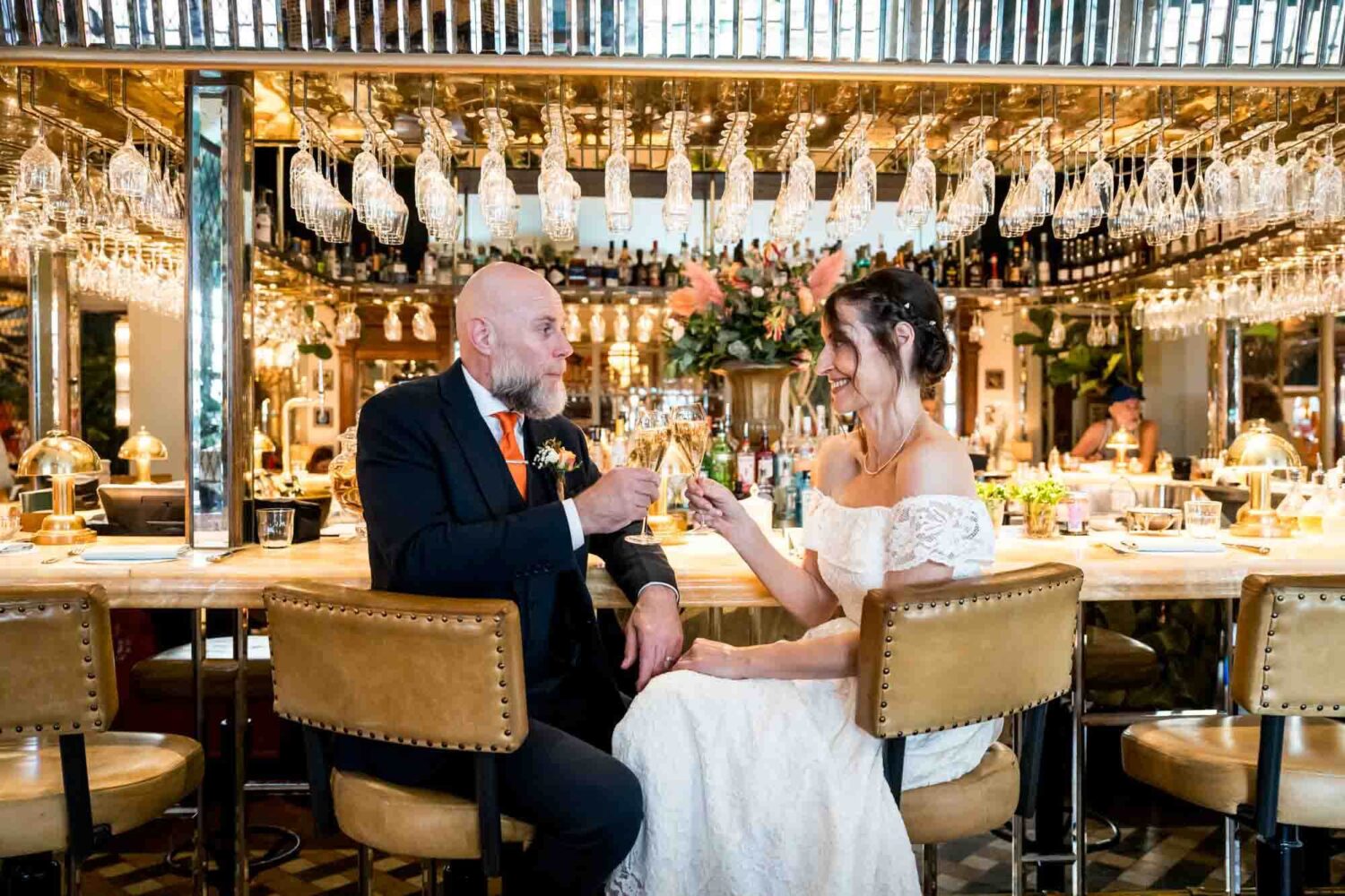 bride-groom-toast-sitting-at-ivy-bar-brighton-town-hall-wedding