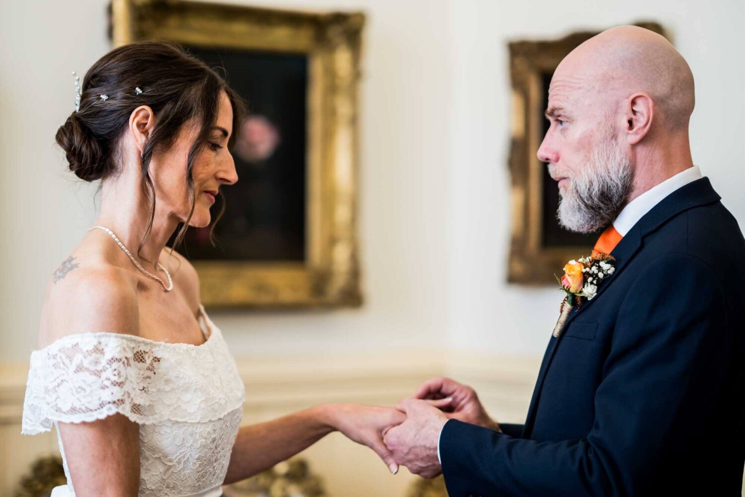 bride-groom-rings-going-hands-brighton-town-hall-wedding