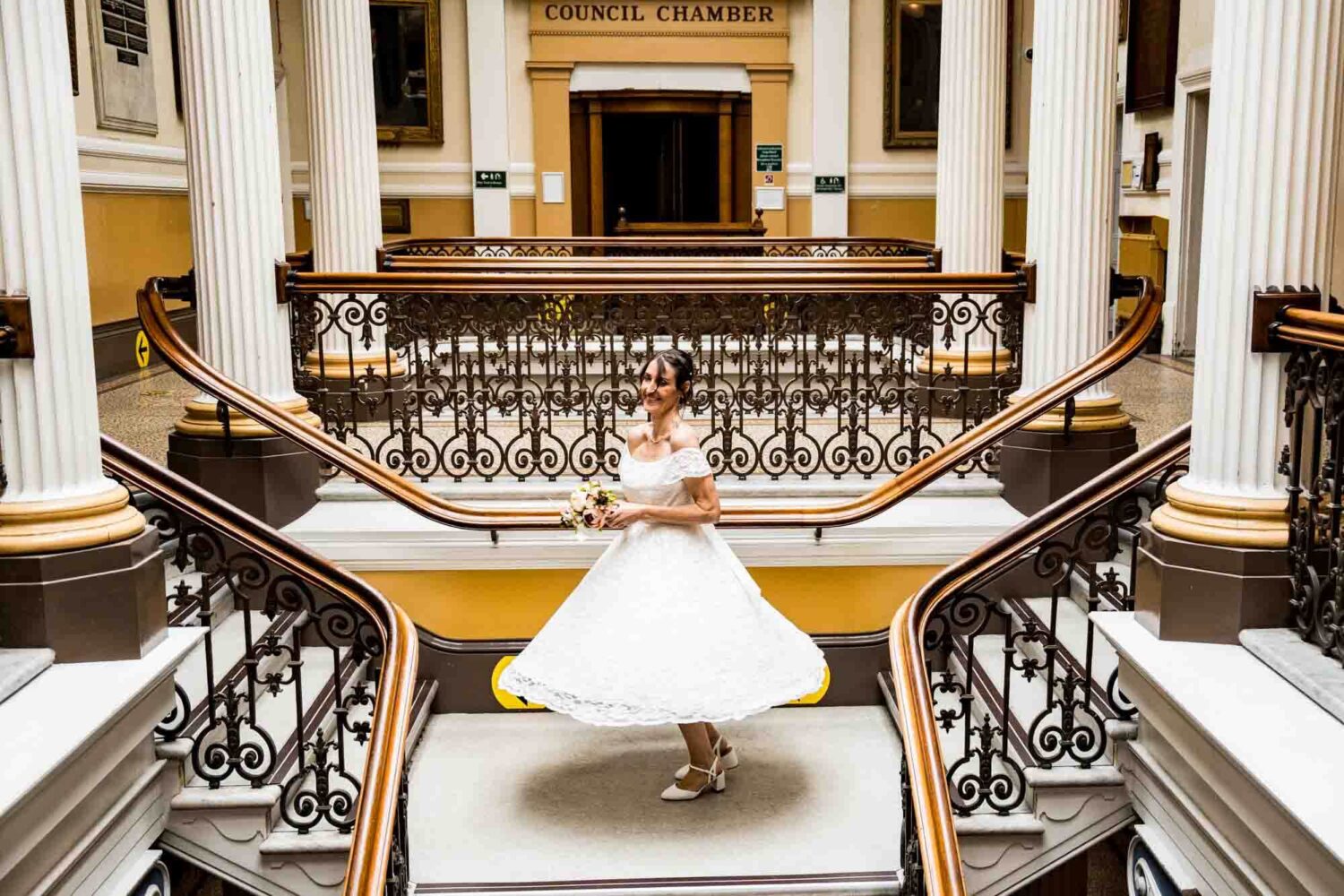 bride-twirling-on-staircase-brighton-town-hall-wedding