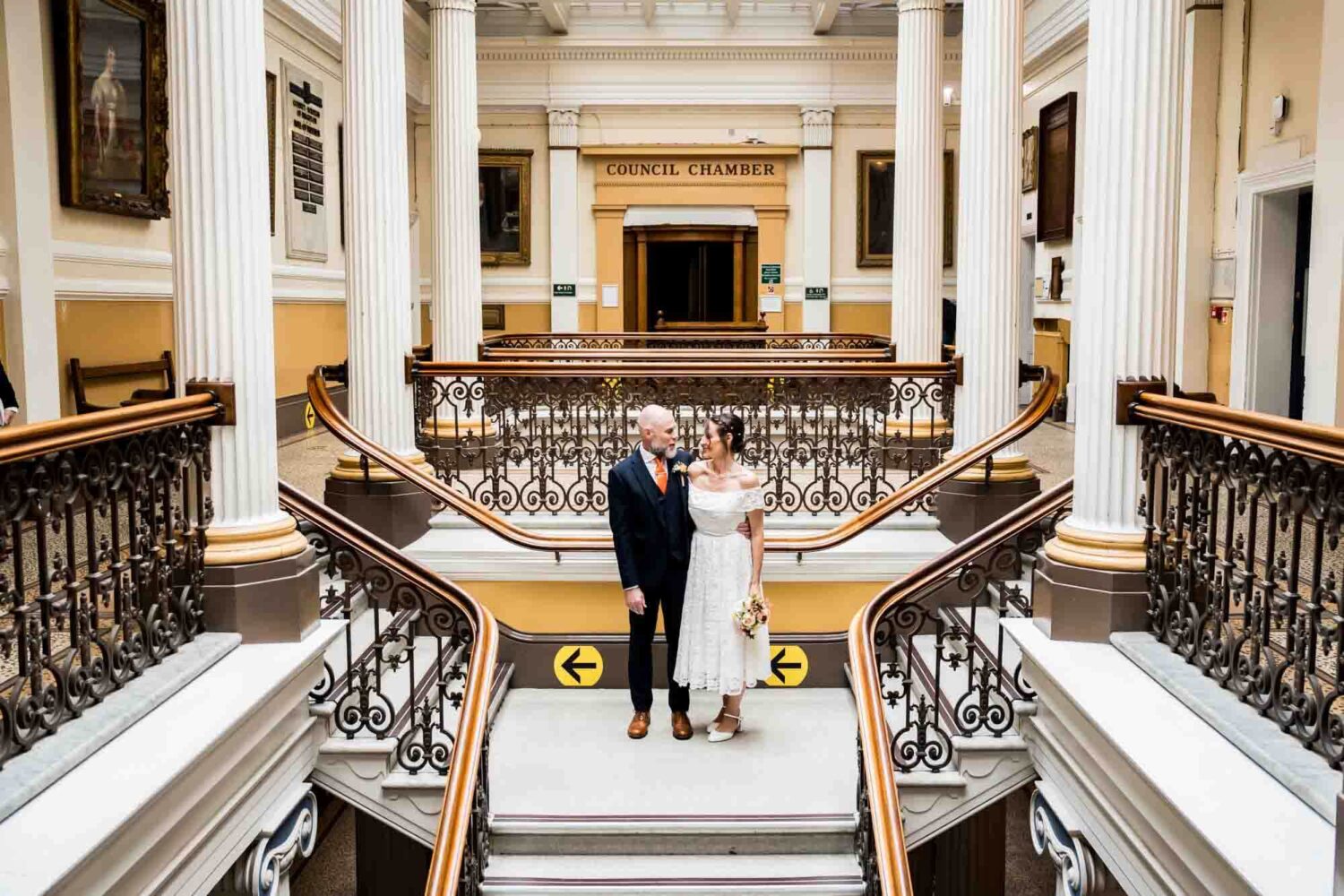bride-and-groom-standing-on-staircase-brighton-town-hall-wedding