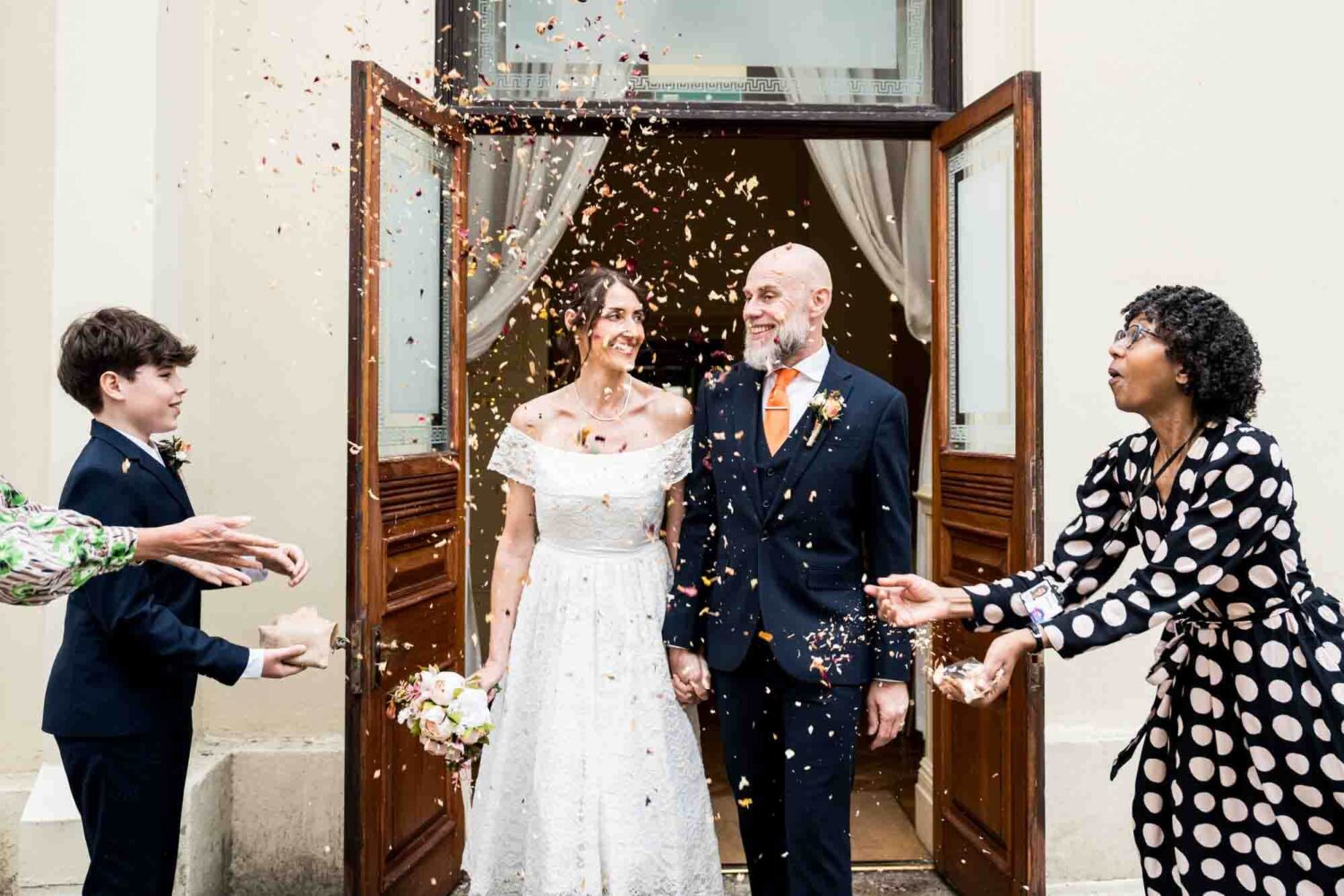 bride-groom-embracing-confetti-brighton-town-hall-wedding