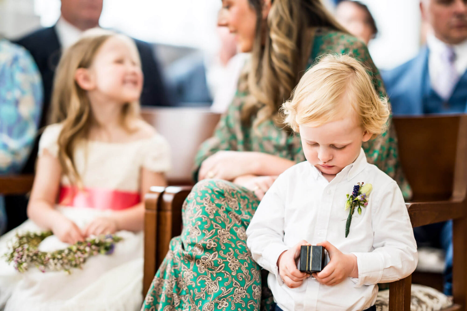 page boy checking ring box london wedding