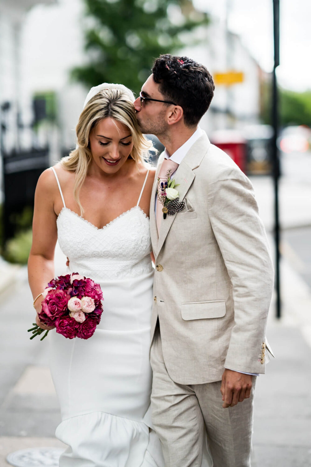 groom kisses bride forehead london wedding
