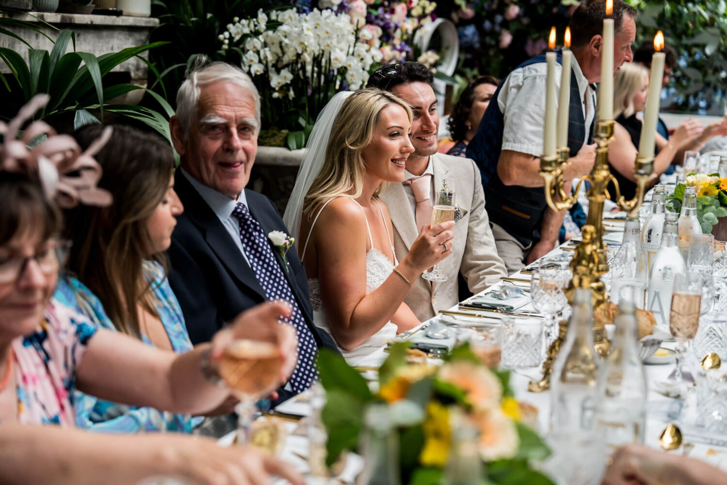 bride and guests at dining table london wedding
