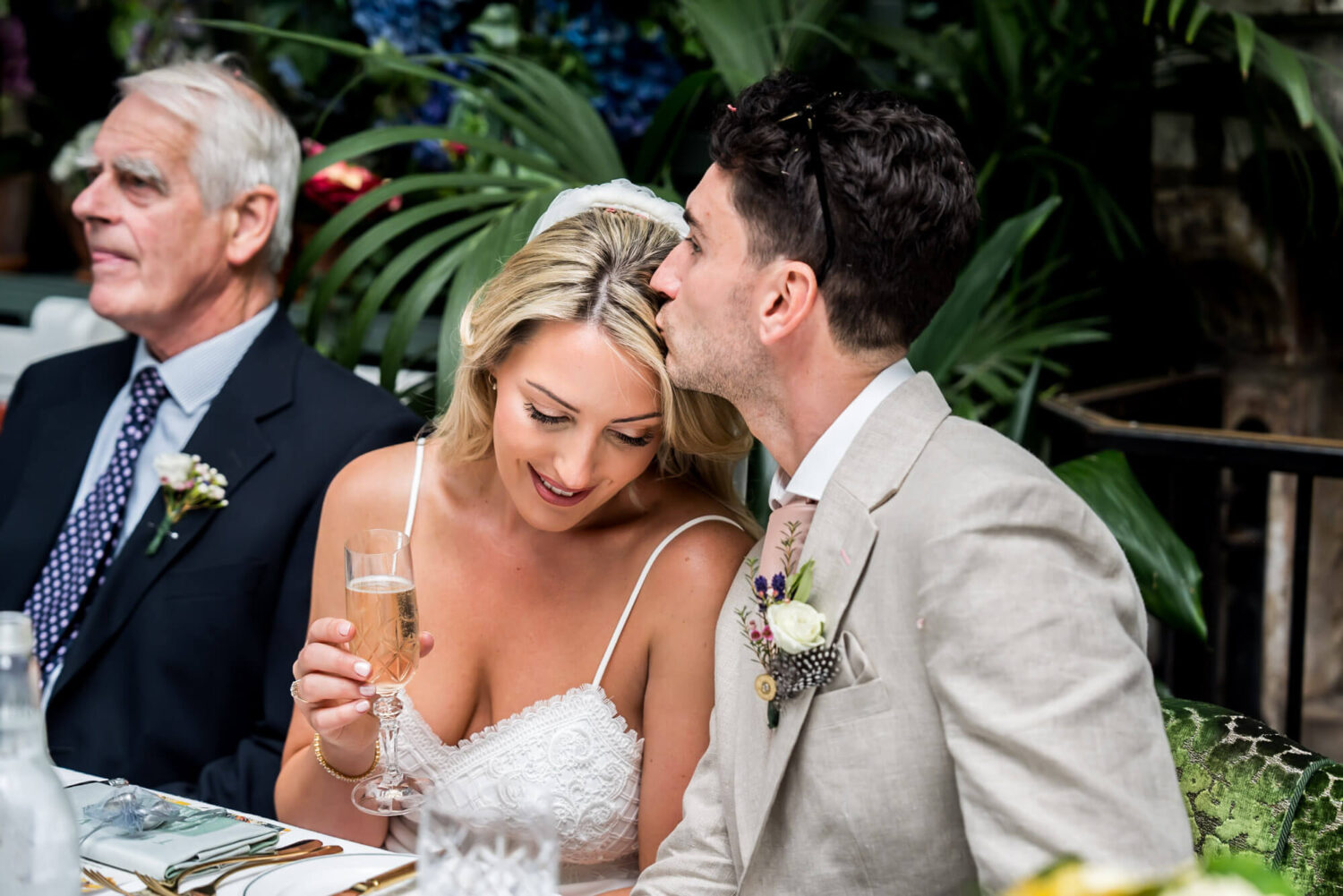 groom kissing brides head london wedding