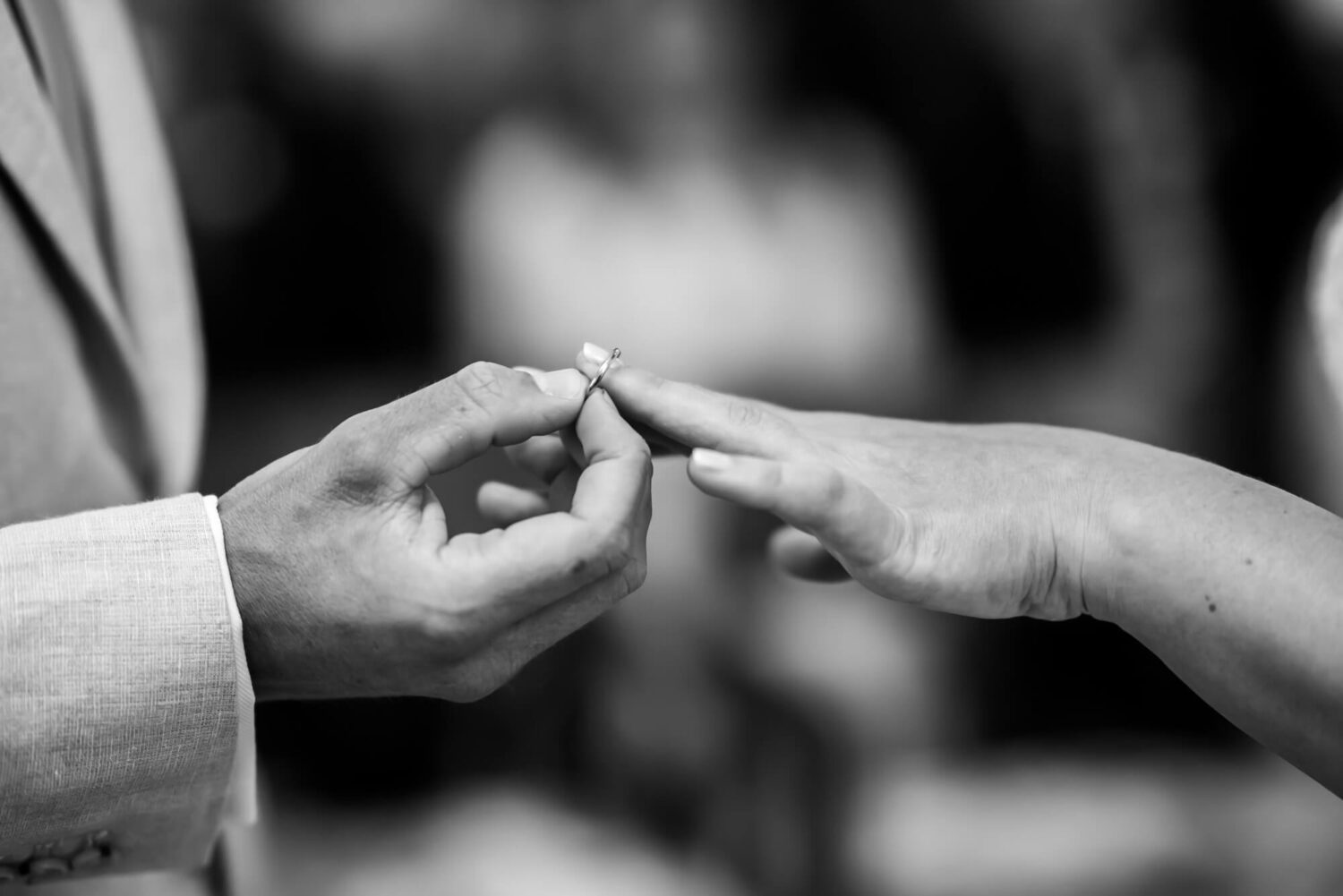 close up of ring poised on finger london wedding
