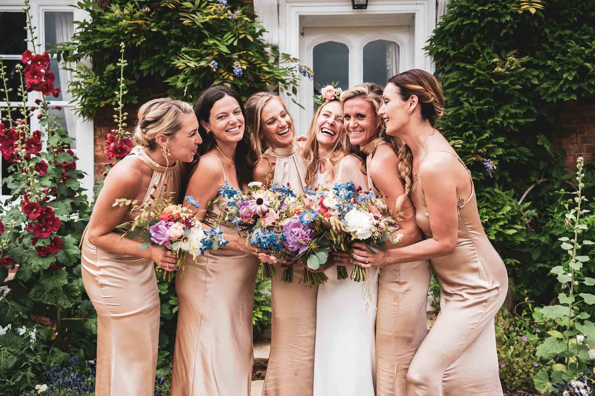 bridesmaids hundled together garden kent wedding