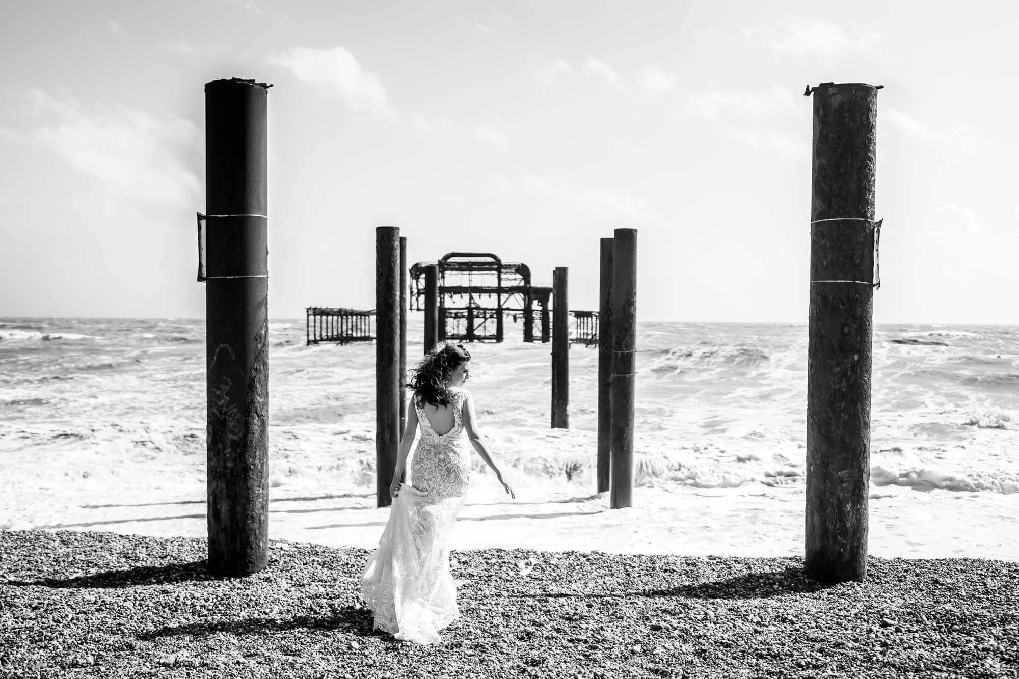 bride looking to the side standing amid west pier remnants