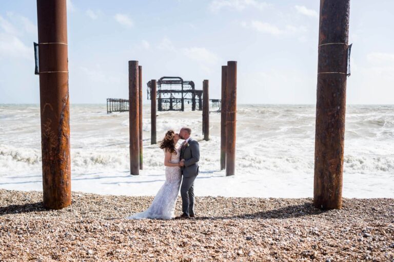 kissing couple with west pier in background