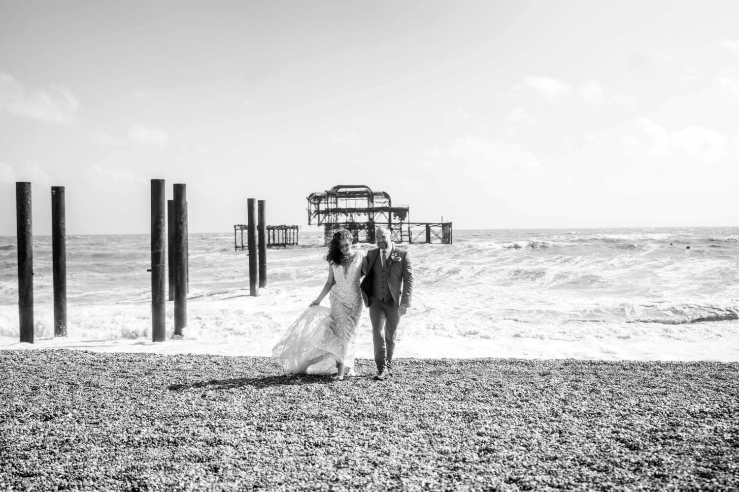 walking by rough windy seas brighton wedding