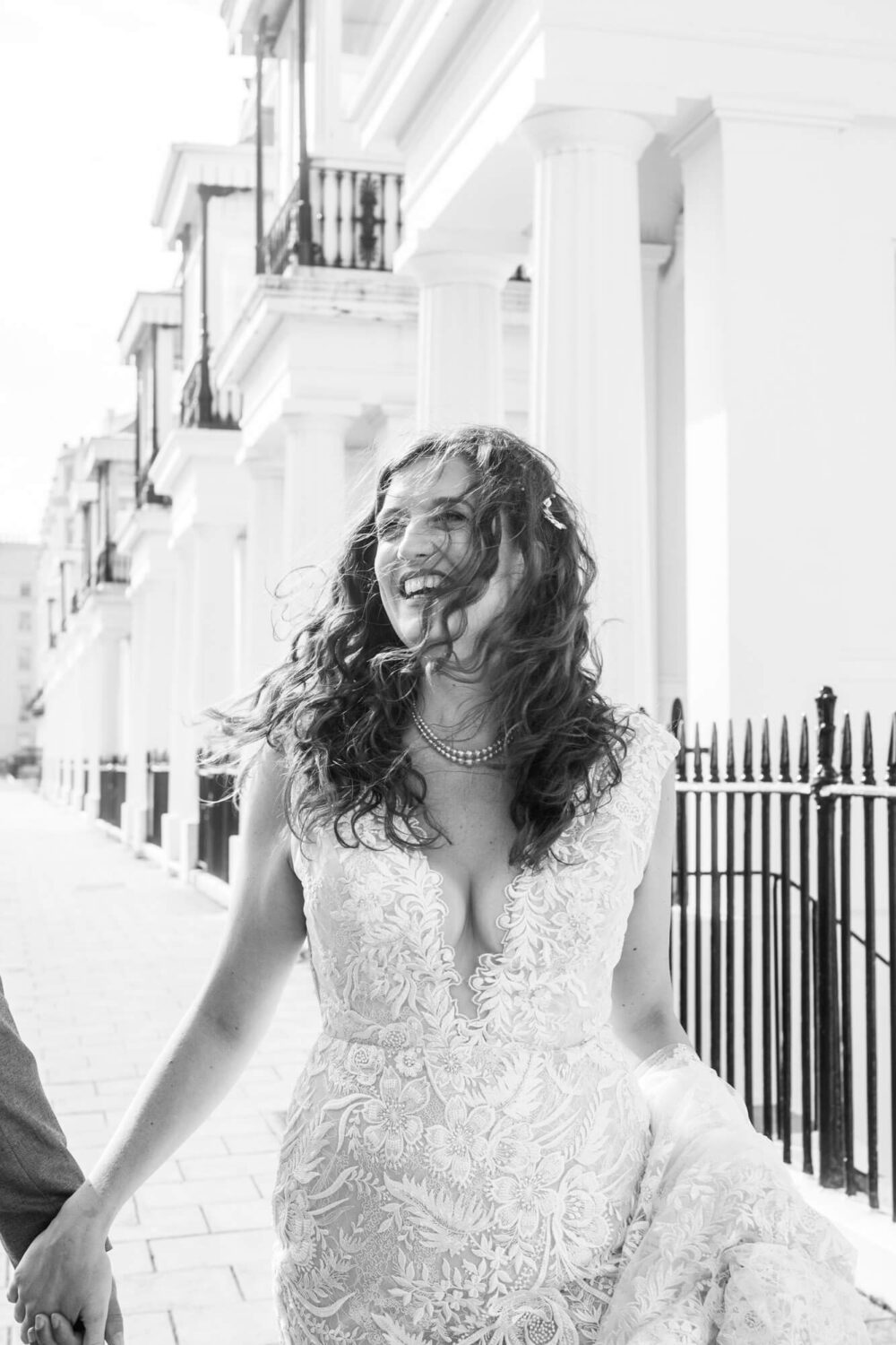 smiling bride with wind swept hair brighton wedding