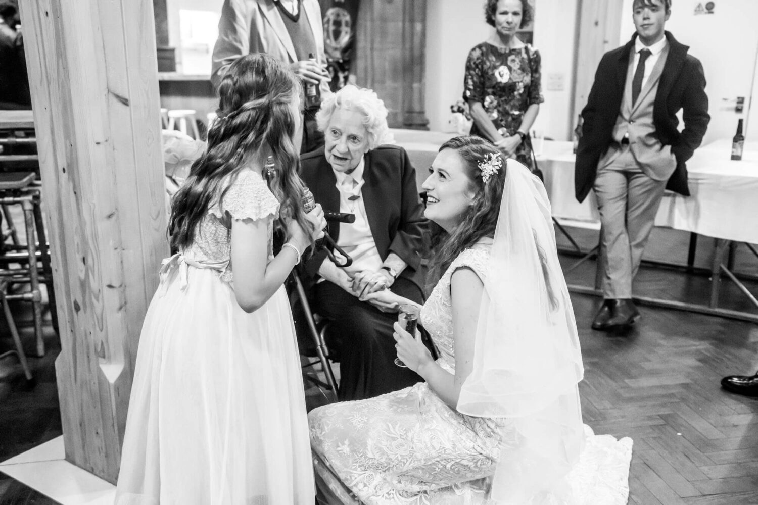 three generations chatting brighton wedding