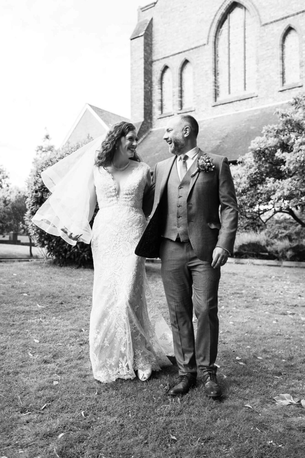 walking laughing bride and groom brighton wedding