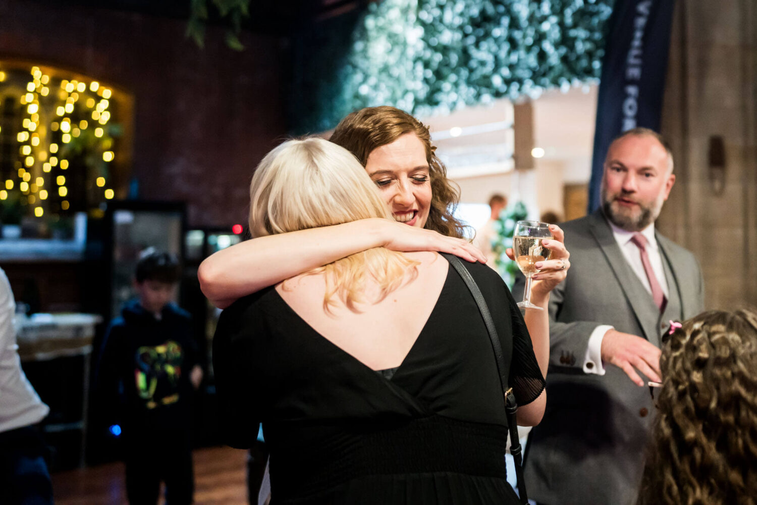 bride hugging guest
