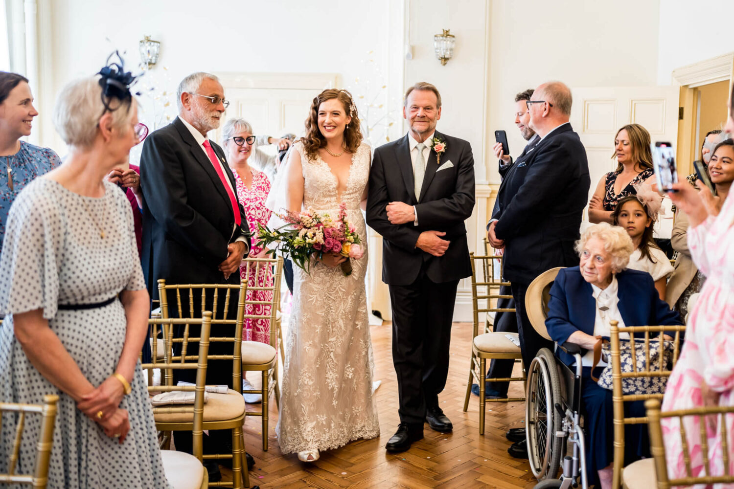 bride and father walking down the aisle smiling brighton wedding