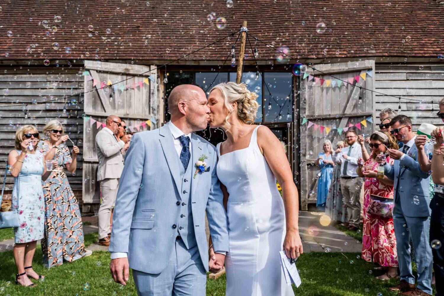 Bride and groom kissing.