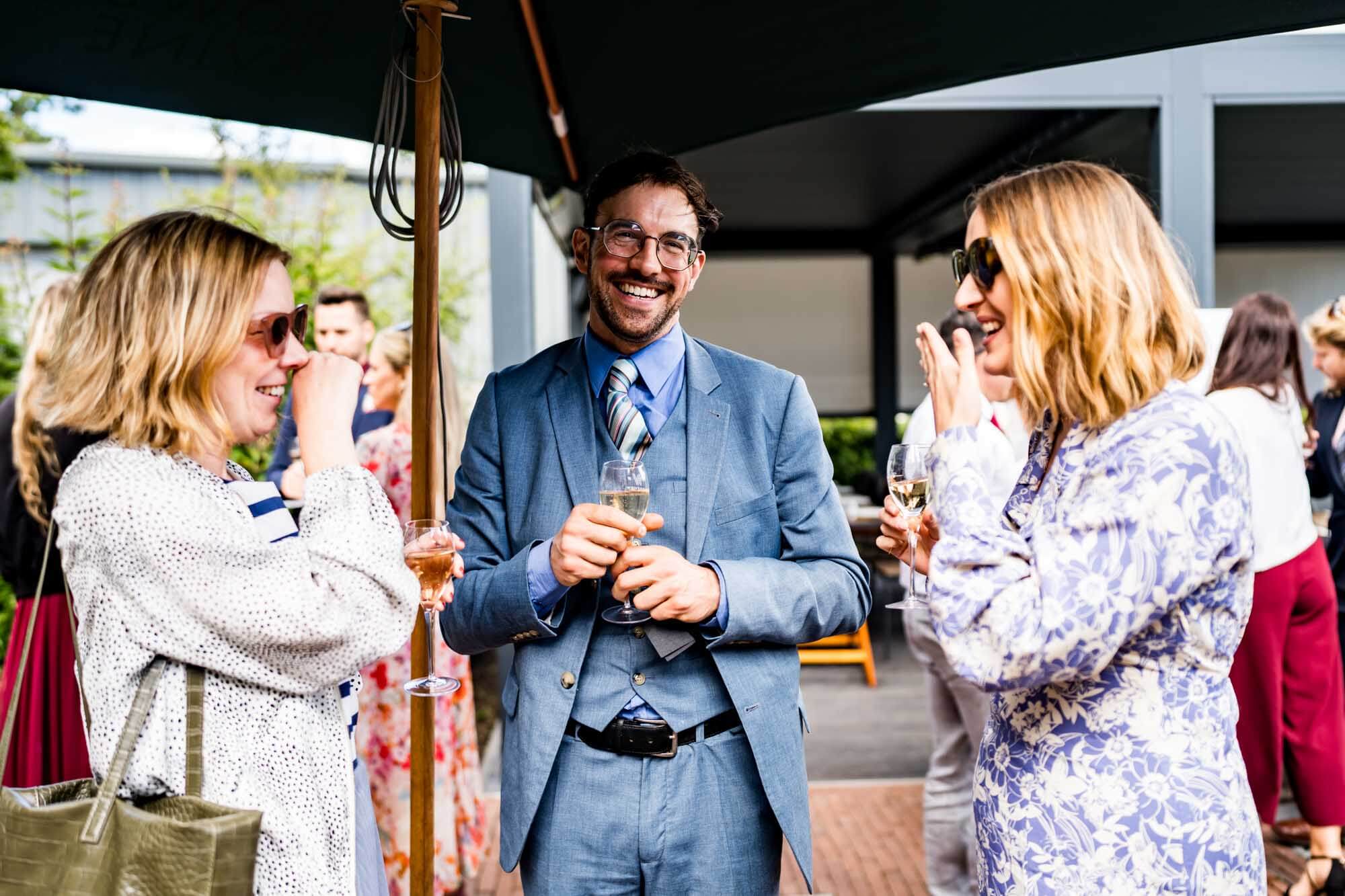 Three guests laughing.