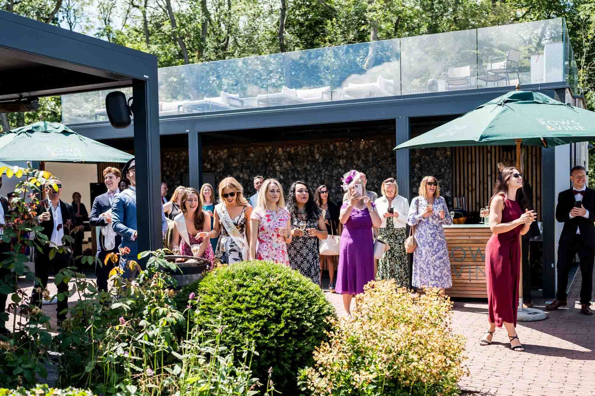 Wedding guests waiting outside.