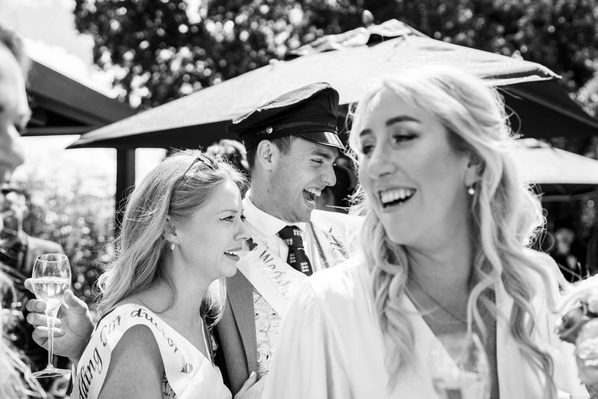 Bride smiling, looking back - B&W.