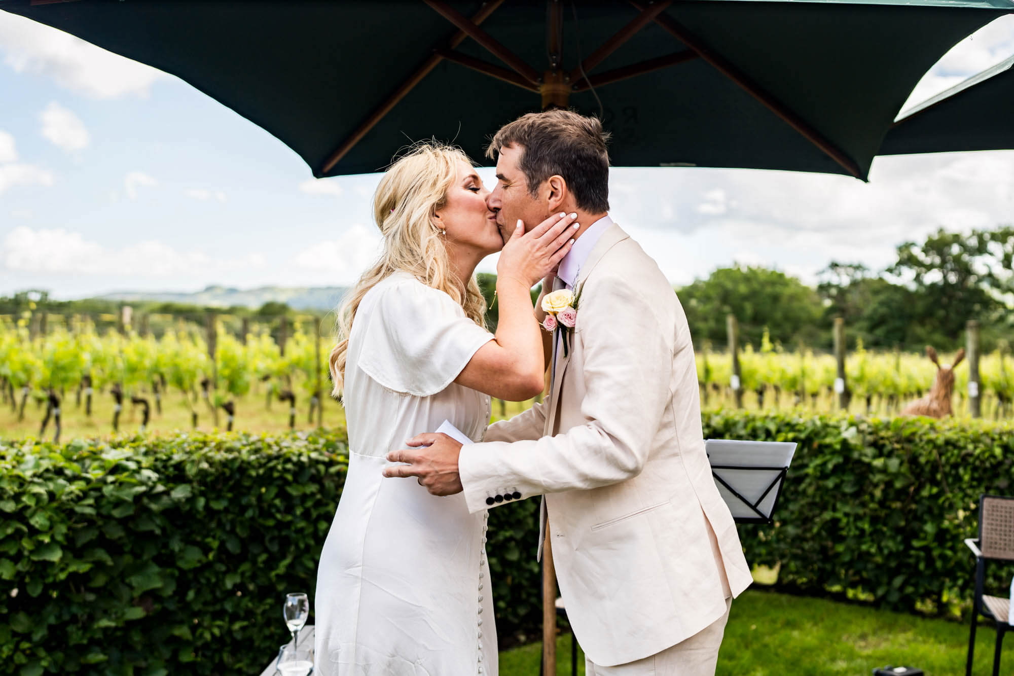 Bride and groom kissing.