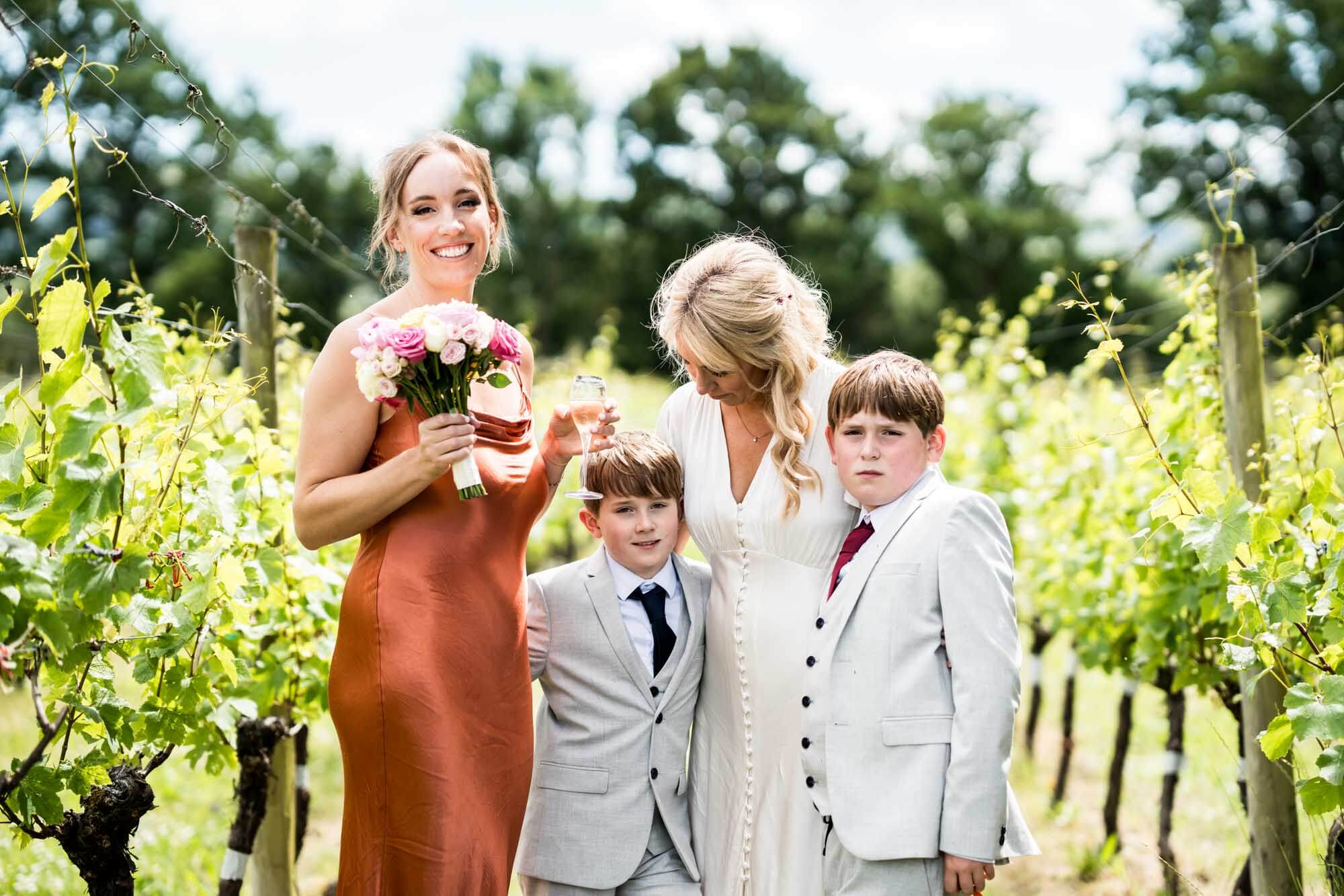 Bride, guest and two boys.