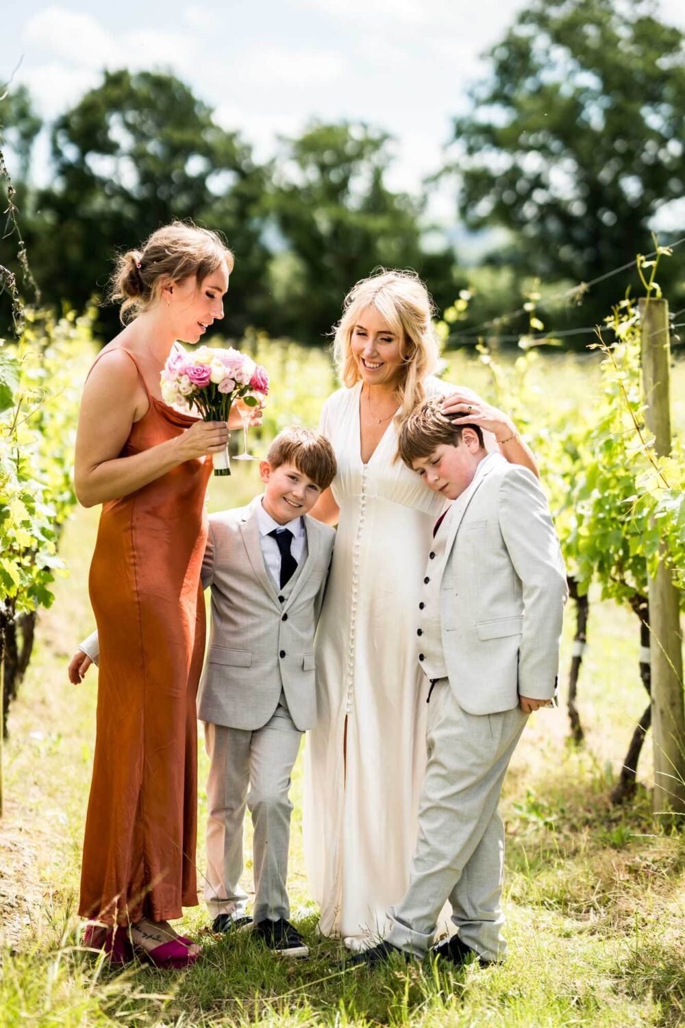 Bride, guest and two boys.