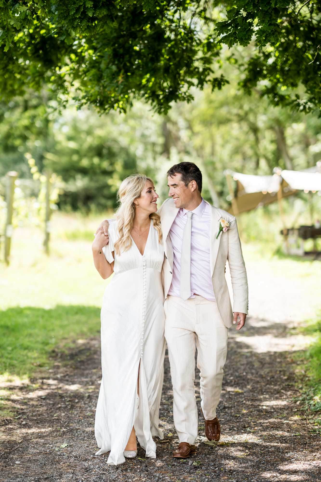 Bride and groom walking.