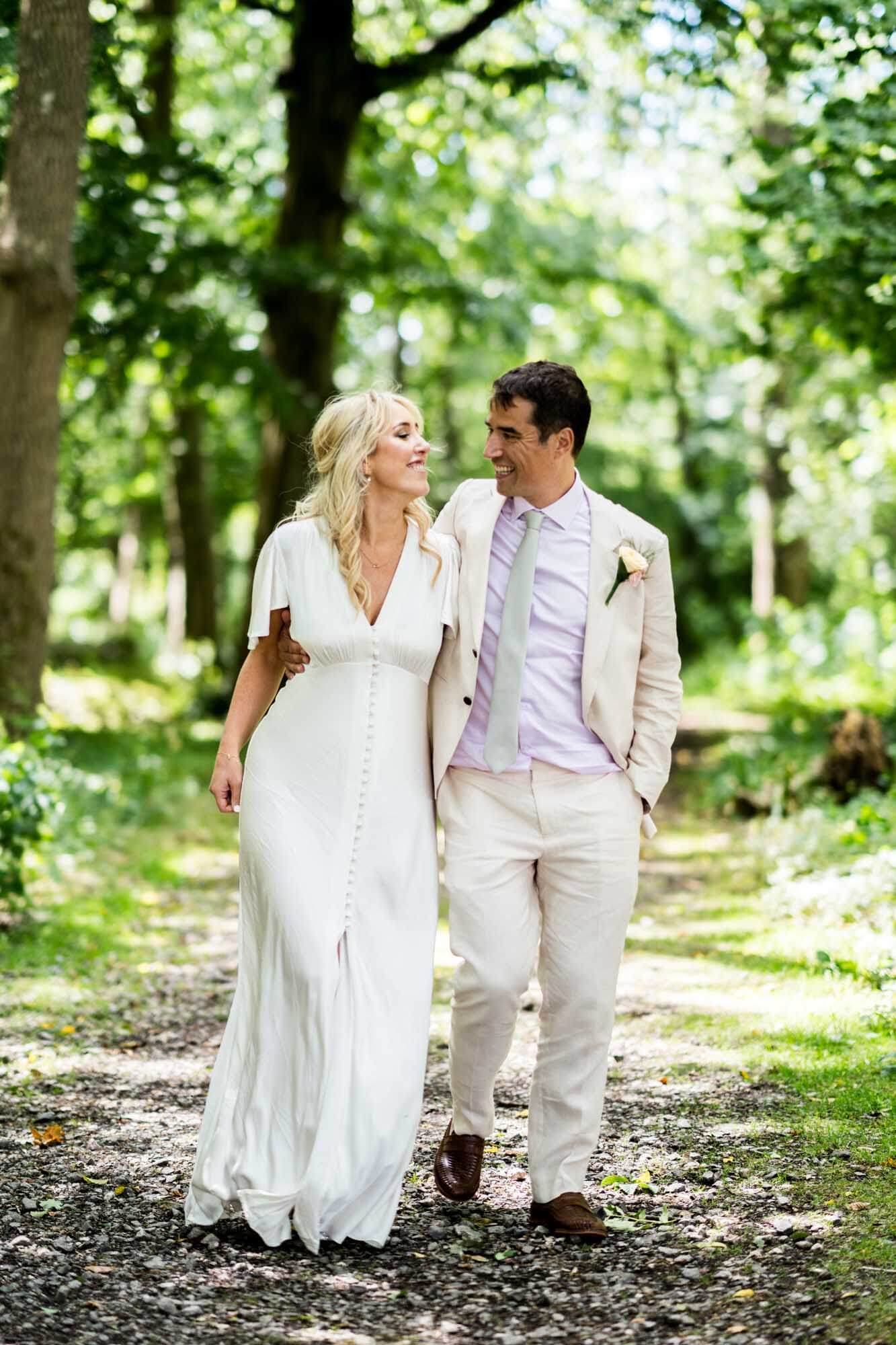 Bride and groom walking.