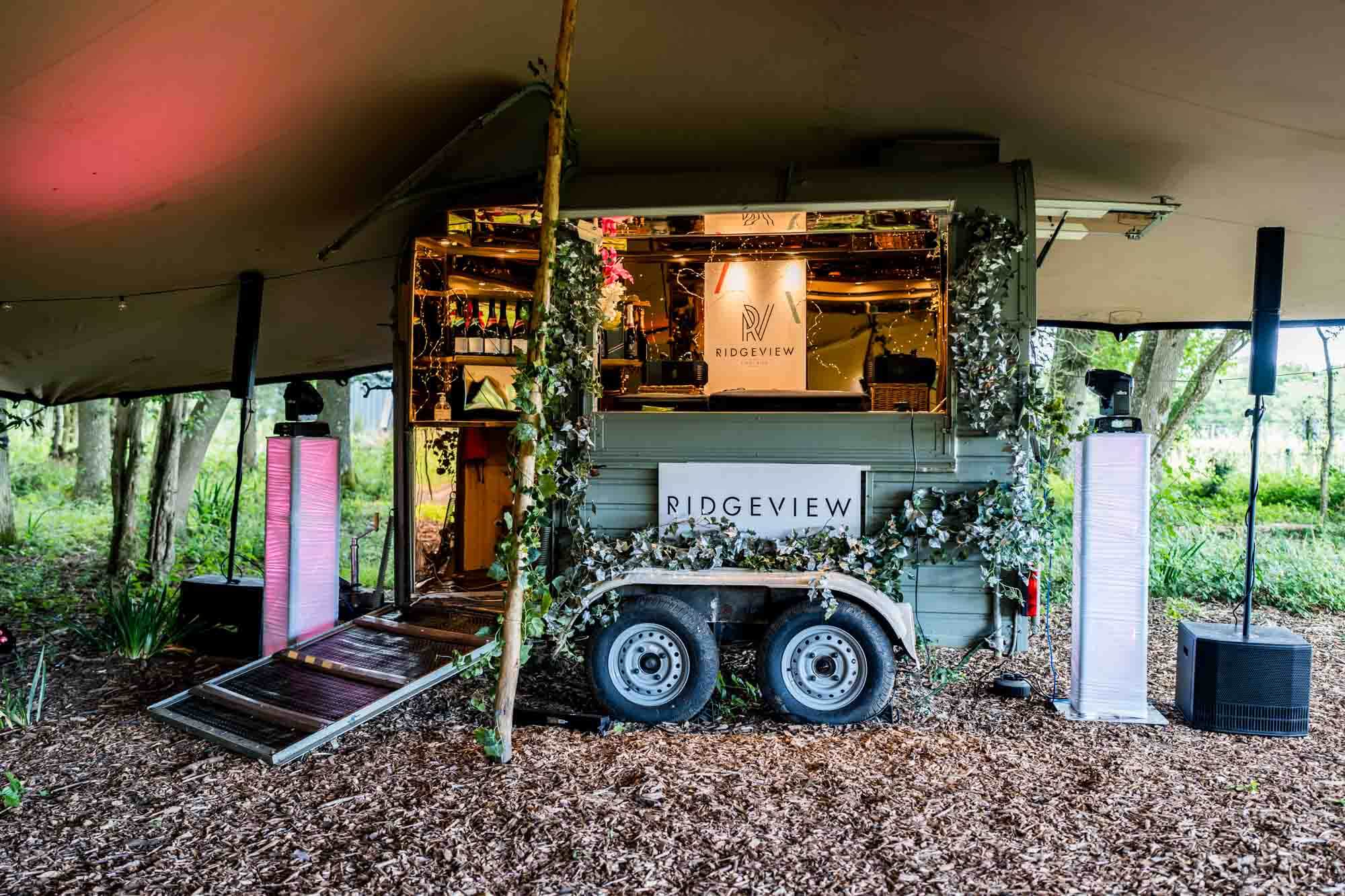Trailer / bar under canopy.