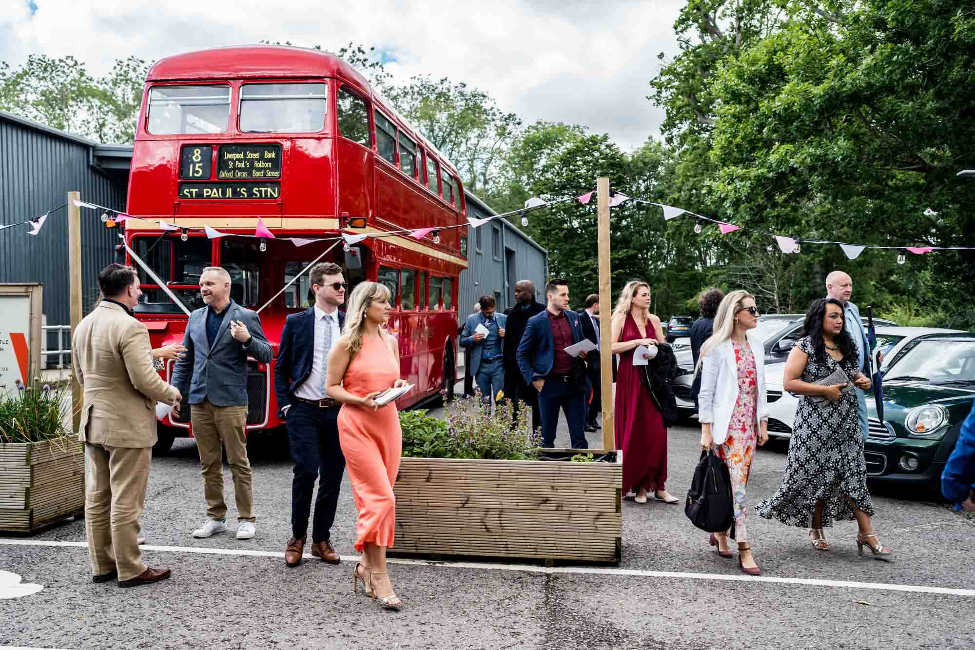 Guests waiting outside old bus.