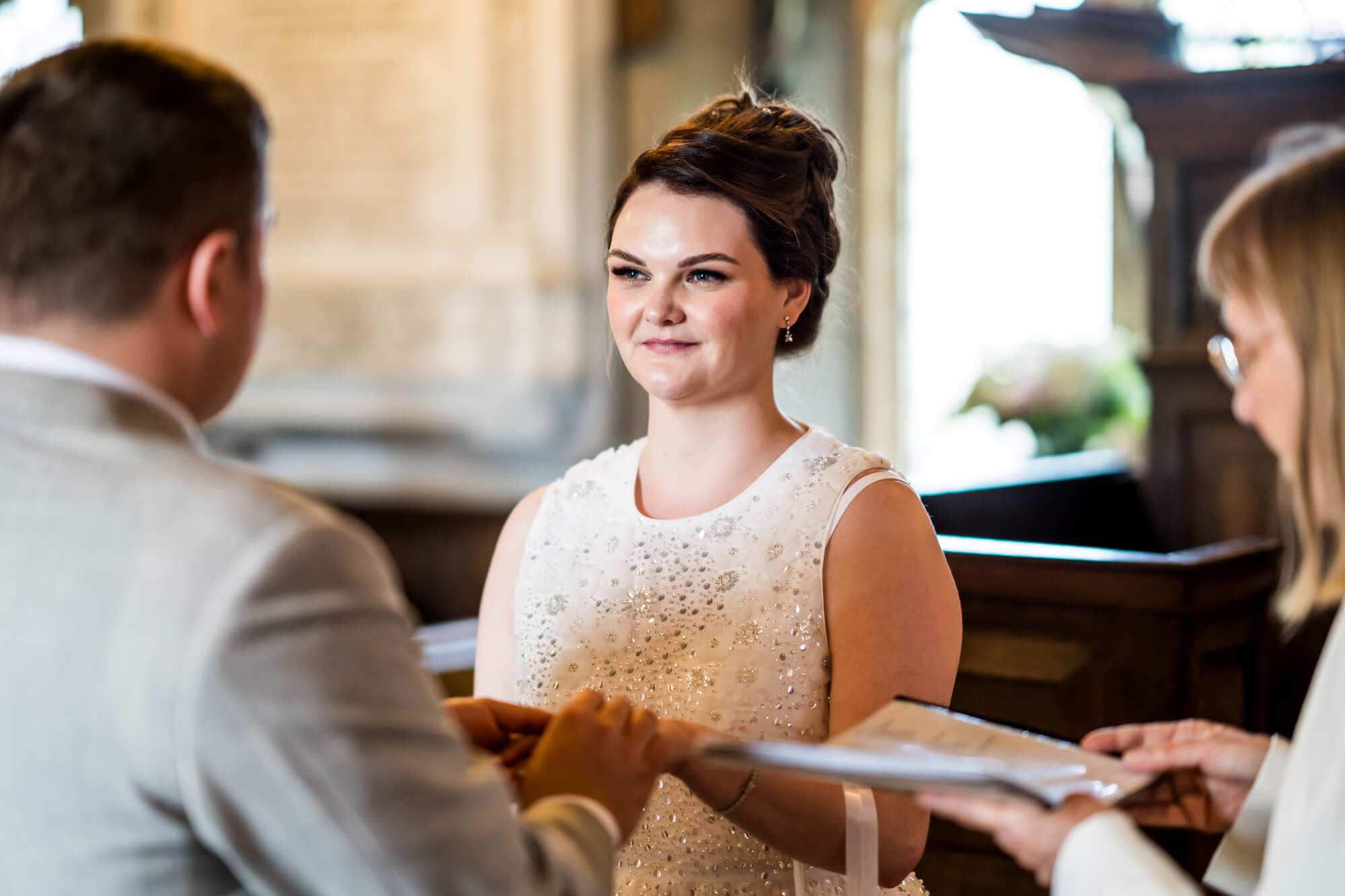 Shot of bride throughout wedding vows.