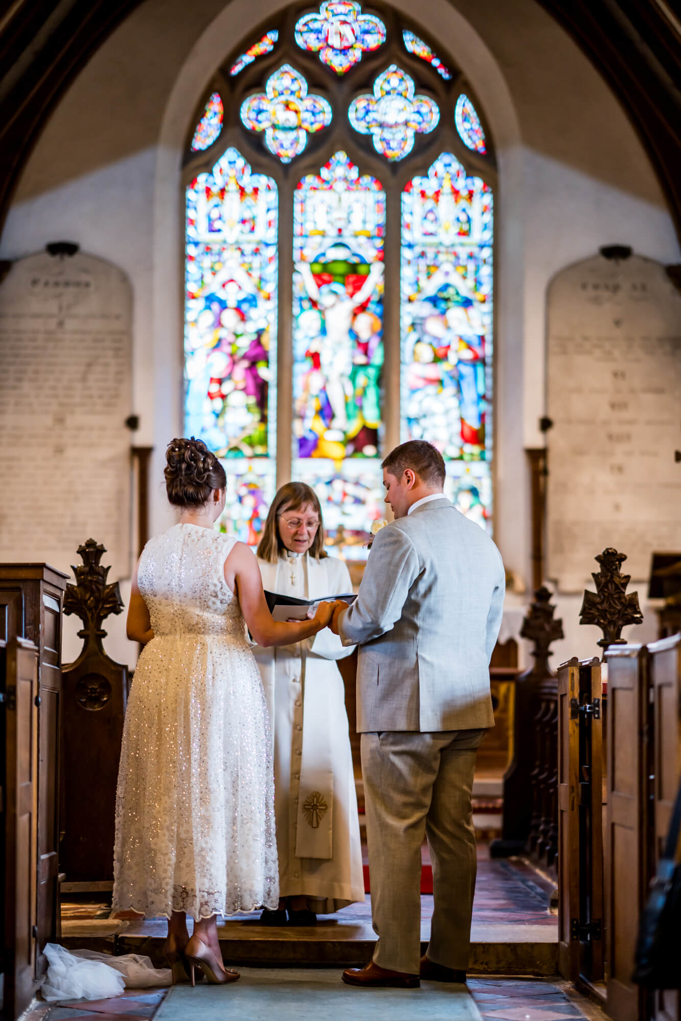 Shot of bride and groom throughout vows.