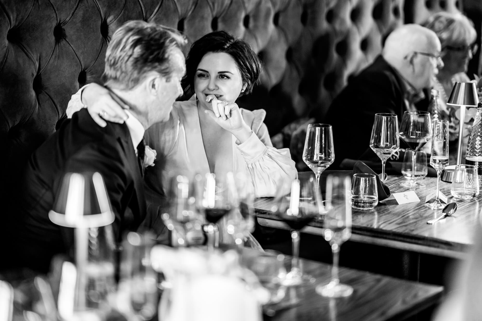 two wedding guests at table - B&W.
