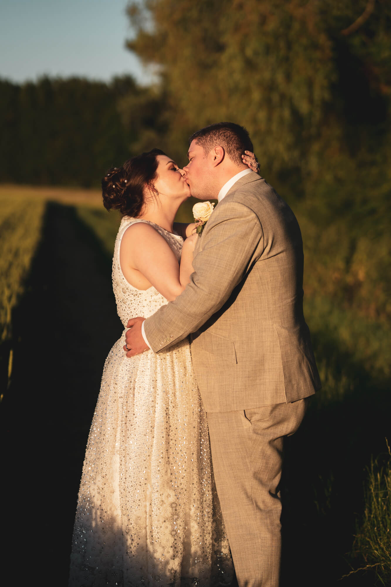 Bride and groom kissing.