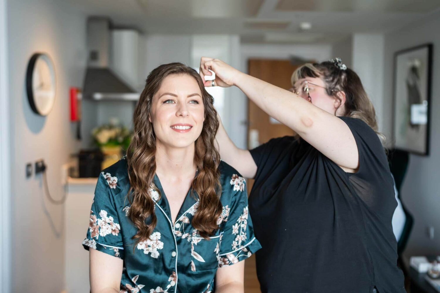 bride smiling looking off into the distance having bridal hair done london wedding