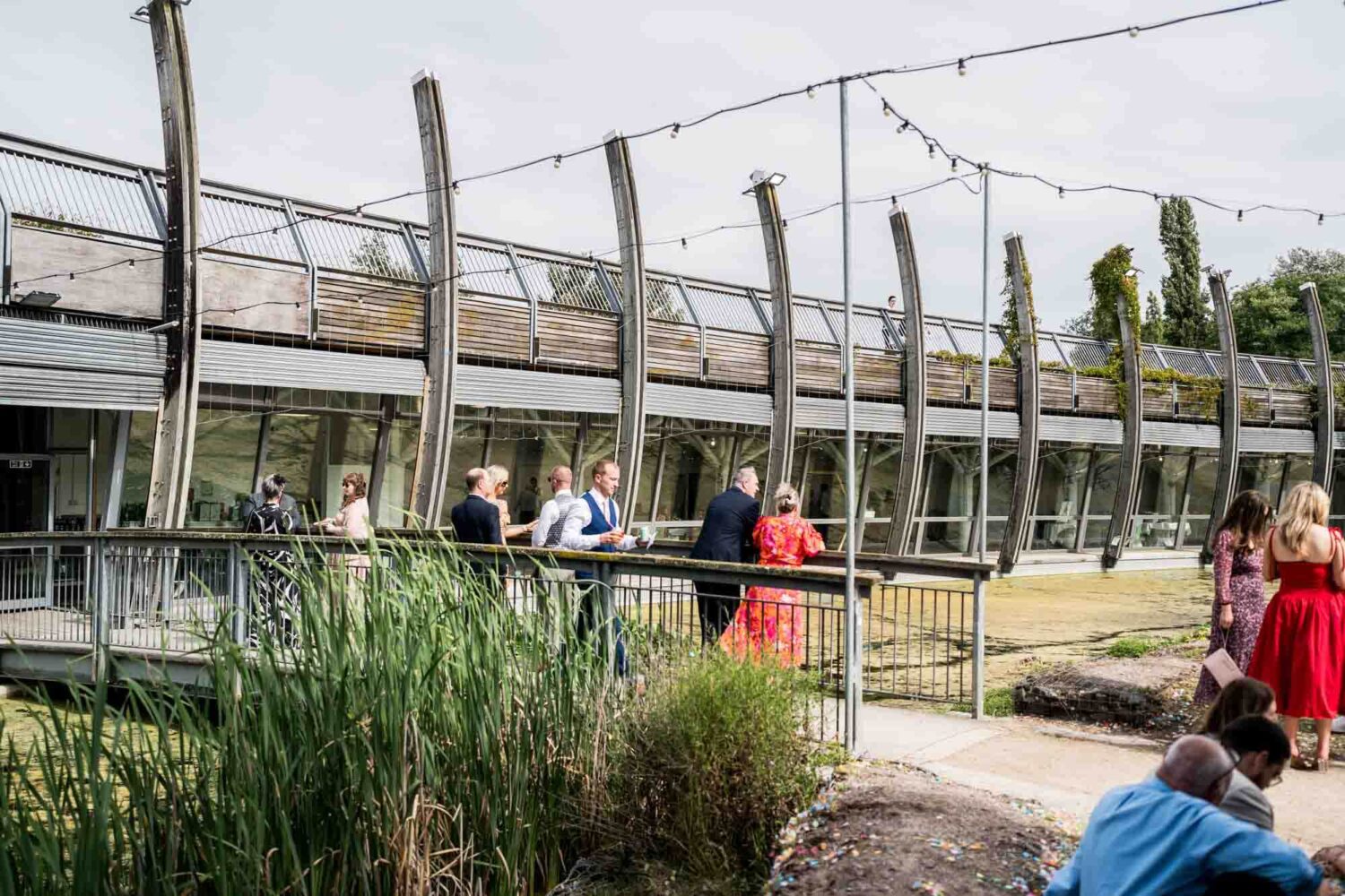 Shot of venue with bridge over pond.