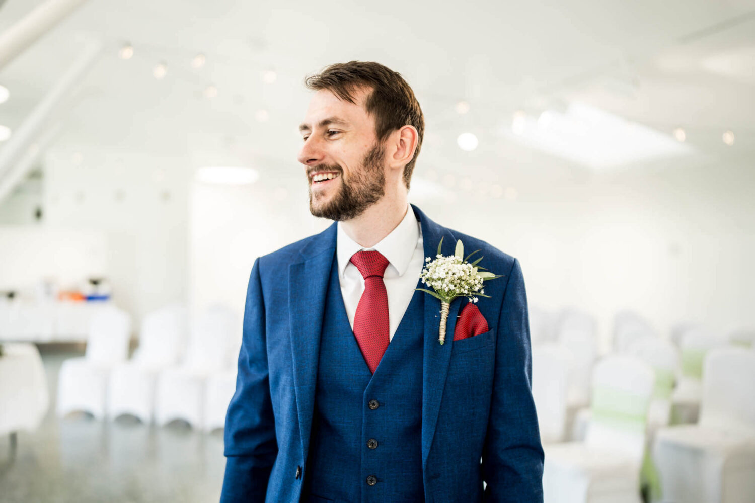 Groom smiling waiting for bride.