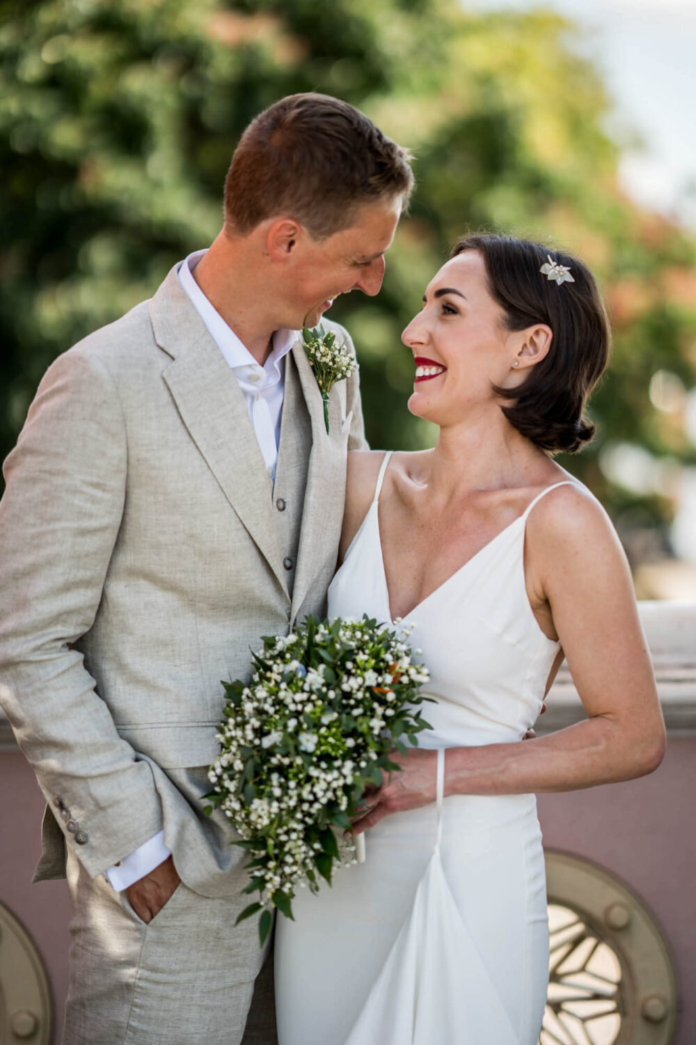 Bride and groom smiling to each other Chelsea wedding.