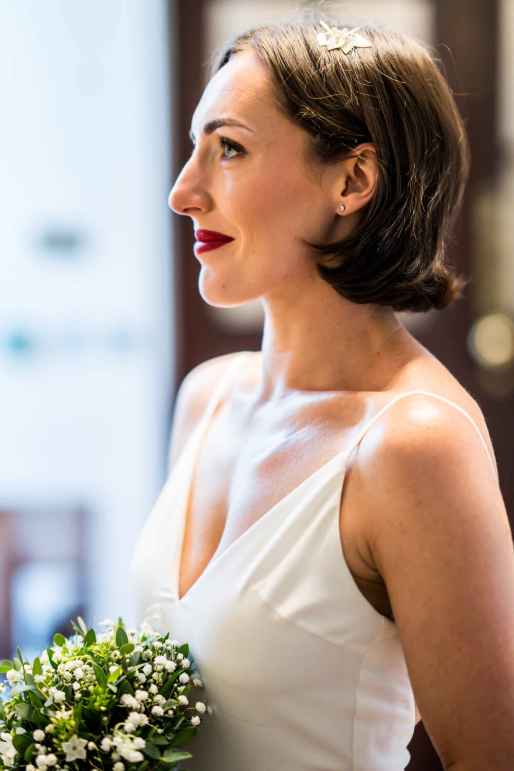 Side portrait of bride smiling Chelsea wedding.