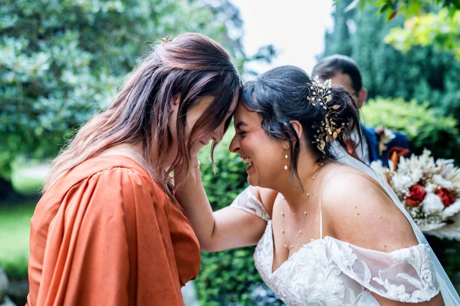 Sister and bride leaning into foreheads smiling Lewes wedding.