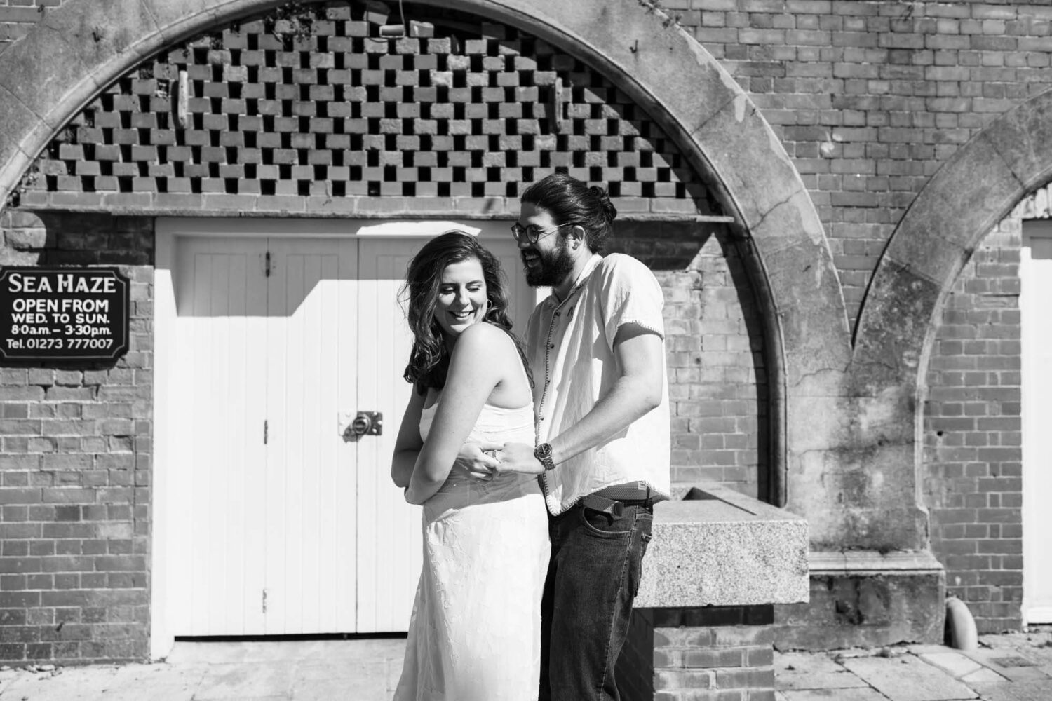 Couple having fun dancing under Brighton's seafront arches Brighton wedding.